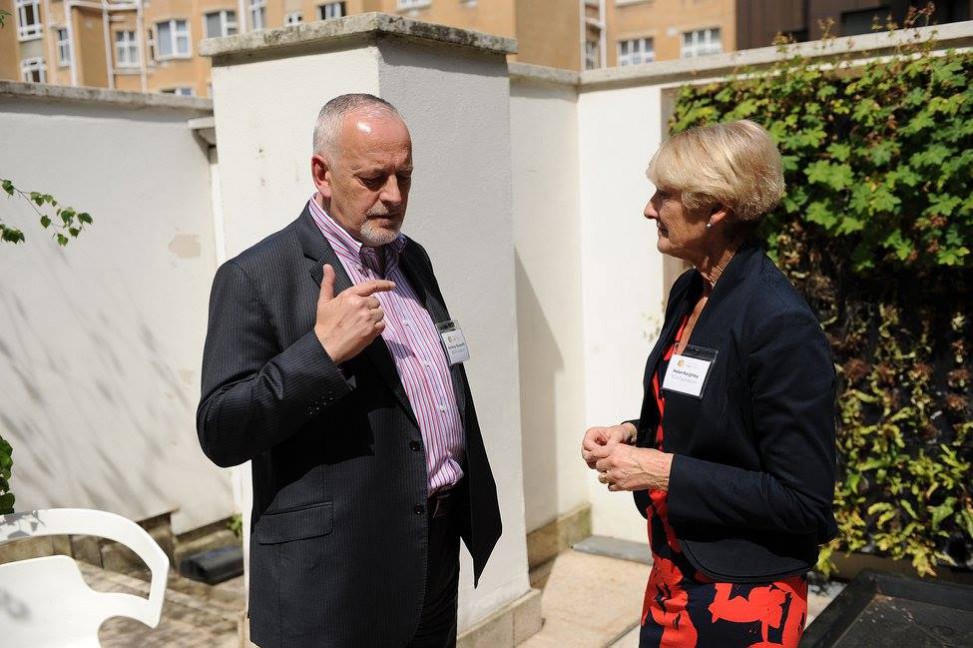 A quiet moment for National Design Academy staff members Anthony Rayworth and Helen Keighley outside at the AGM event, discussing BIID's future plans. at this year's BIID annual conference.