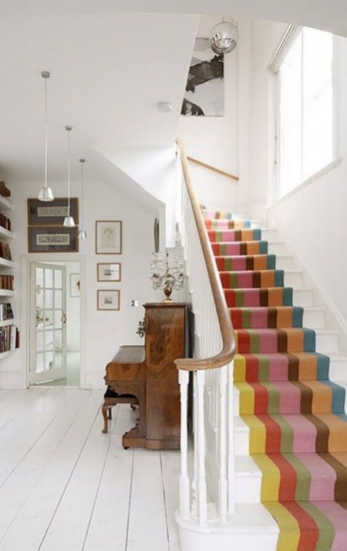 Hallway flooring ideas LOVE CHIC LIVING (2013) A striped stair runner teamed with a muted, white painted hall and landing that reflects light and maximise height. Whilst the colourful runner adds a fun element to this traditional space.