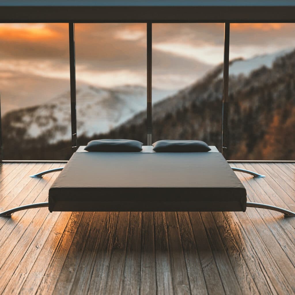 Image of a bed in front of a mountain view