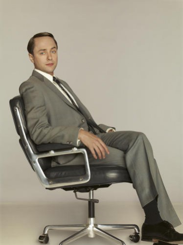 Mad Men Set Design Interior Design Trends. Account man Pete Campbell sitting in an Eames Time-Life chair. 