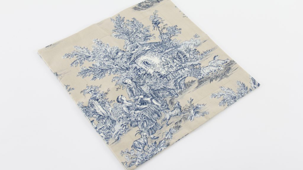 Nicoletta Perris Magnetto's soft furnishings cushion cover sample in a natural, Toile print by our Student of the Month, submitted as part of her Diploma in Curtain Making & Soft Furnishings work.