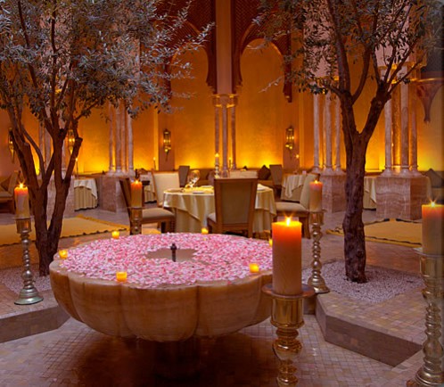 The hotel's beautiful restaurant draped in floral pink petals and gold accents throughout. Sex and the city set design inspired interiors.