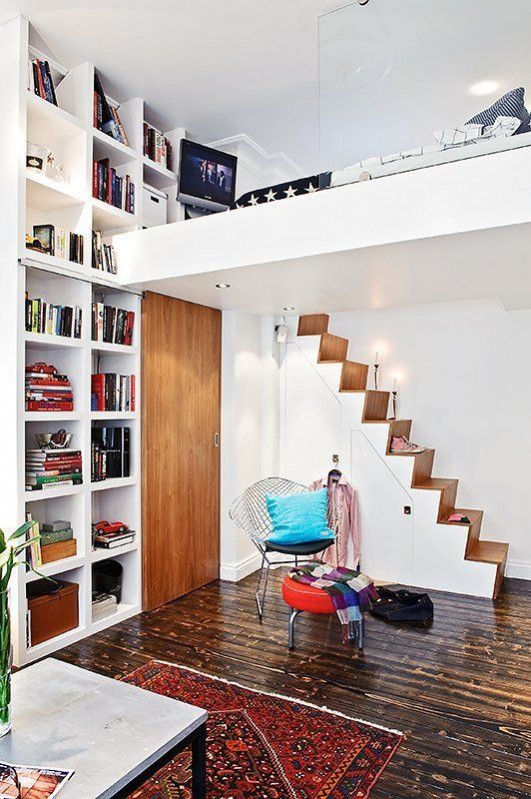 How to de-clutter your interior this January: The KonMari method, asks you to divide your belongings into categories, before reorganising. Everything has a space in your new clutter-free home like any books kept that spark joy. You can begin organising by colour. Found on apartmenttherapy.com 