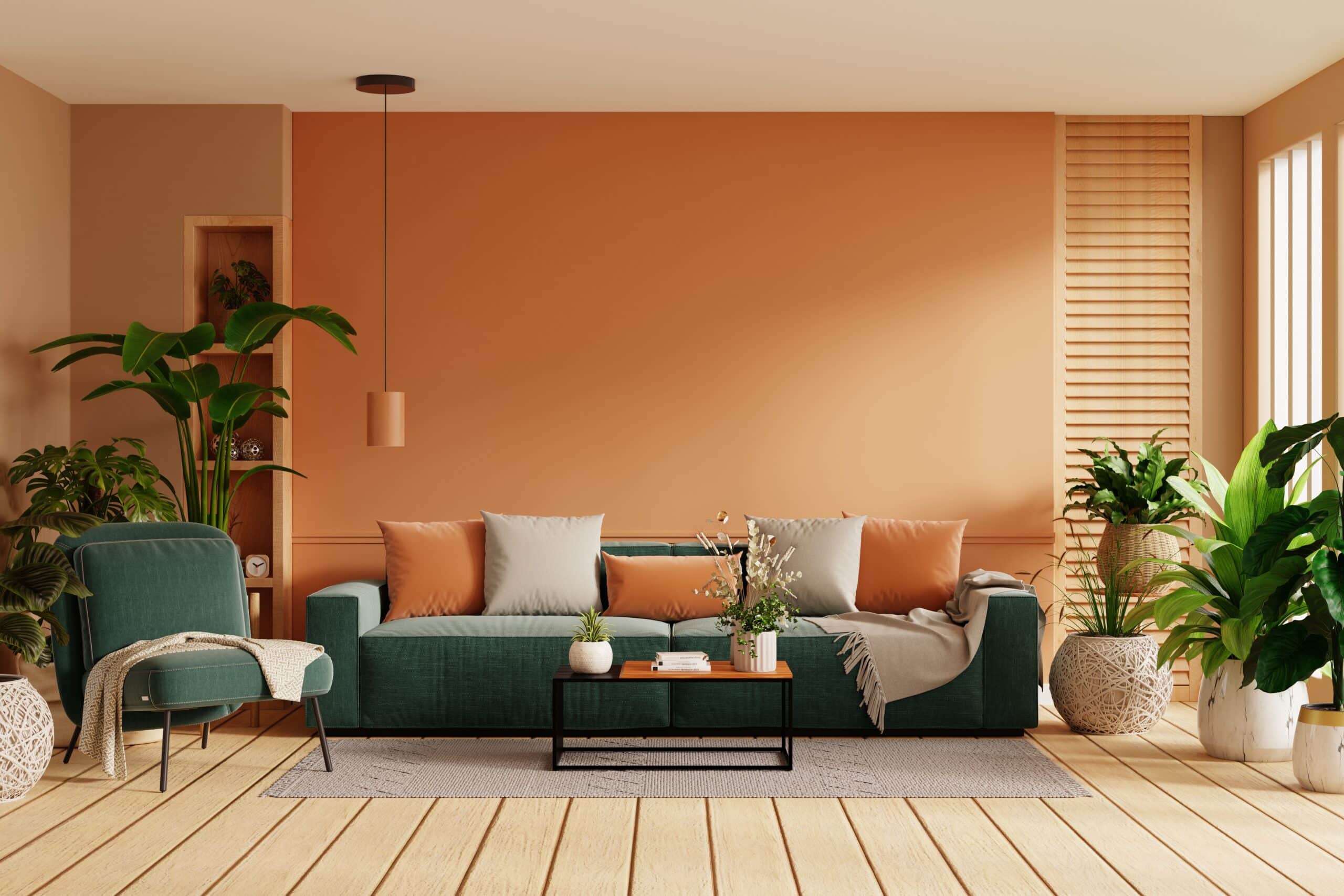Terracotta living room with a green sofa and indoor plants